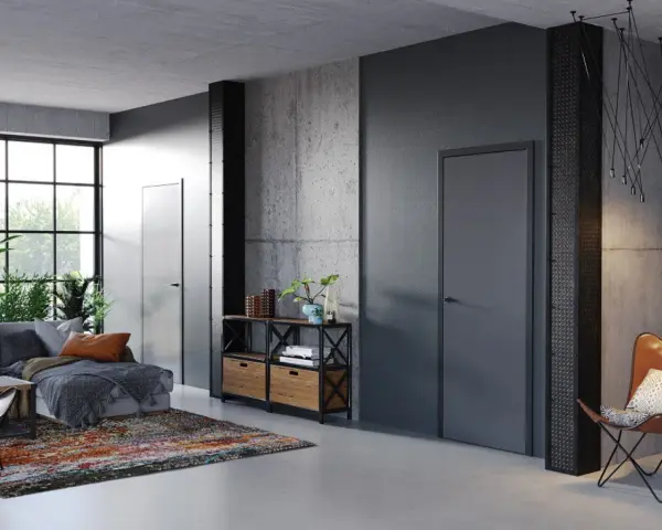 Nowoczesne wnętrze z betonowymi ścianami i drzwiami Porta System, które podkreślają elegancję przestrzeni.