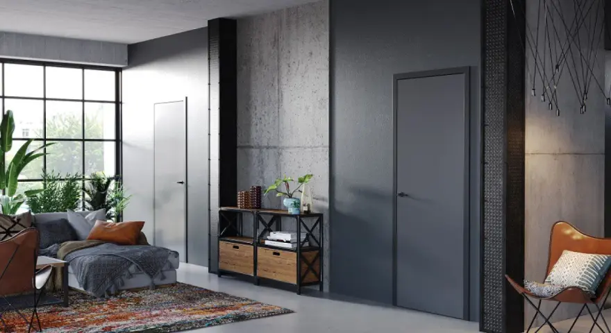 Nowoczesne wnętrze z betonowymi ścianami i drzwiami Porta System, które podkreślają elegancję przestrzeni.