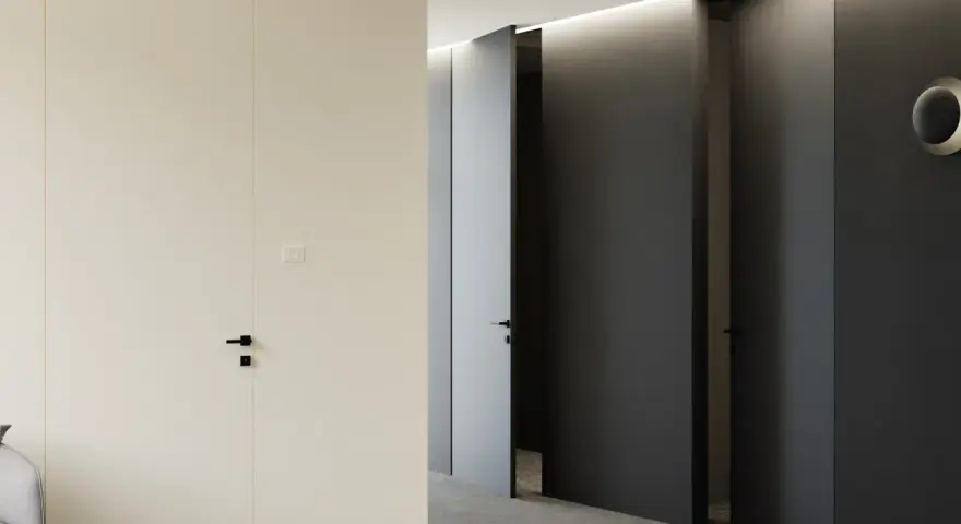 Korytarz z drzwiami w odwróconej przylgi, jedna jasna, dwie ciemne, minimalistyczne, nowoczesne wnętrze.